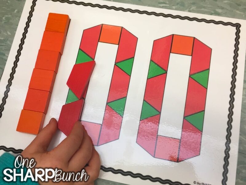 100-day-pattern-blocks A student fills in the shape of the number 100 with pattern blocks