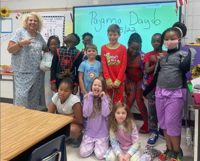 Spirit Week Ideas: Pajama Day Students and teacher dressed up for school pajama day