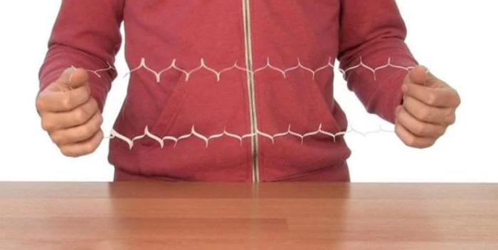 Third Grade Science Surface Area Steve Spangler Science student holding an index card cut in a way that forms a large opening